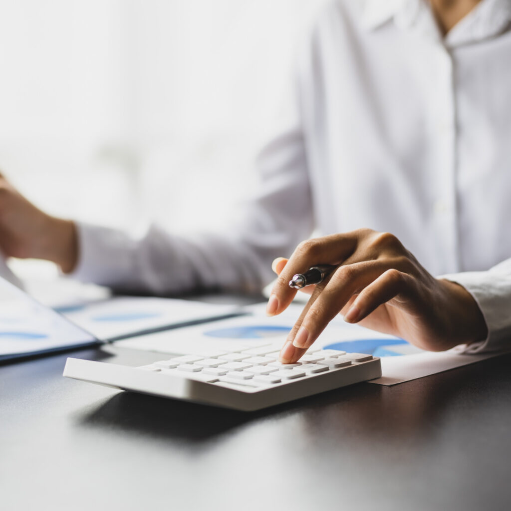 Accountant calculating finance numbers on a calculator