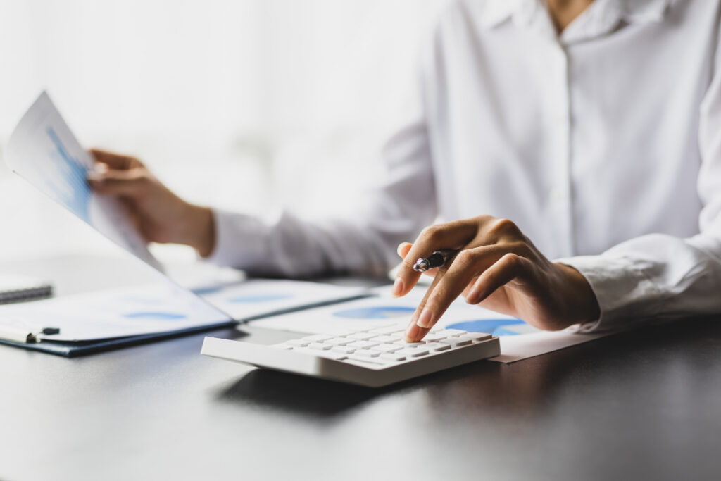 Accountant calculating finance numbers on a calculator